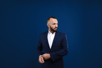 Portrait of handsome man on blue background