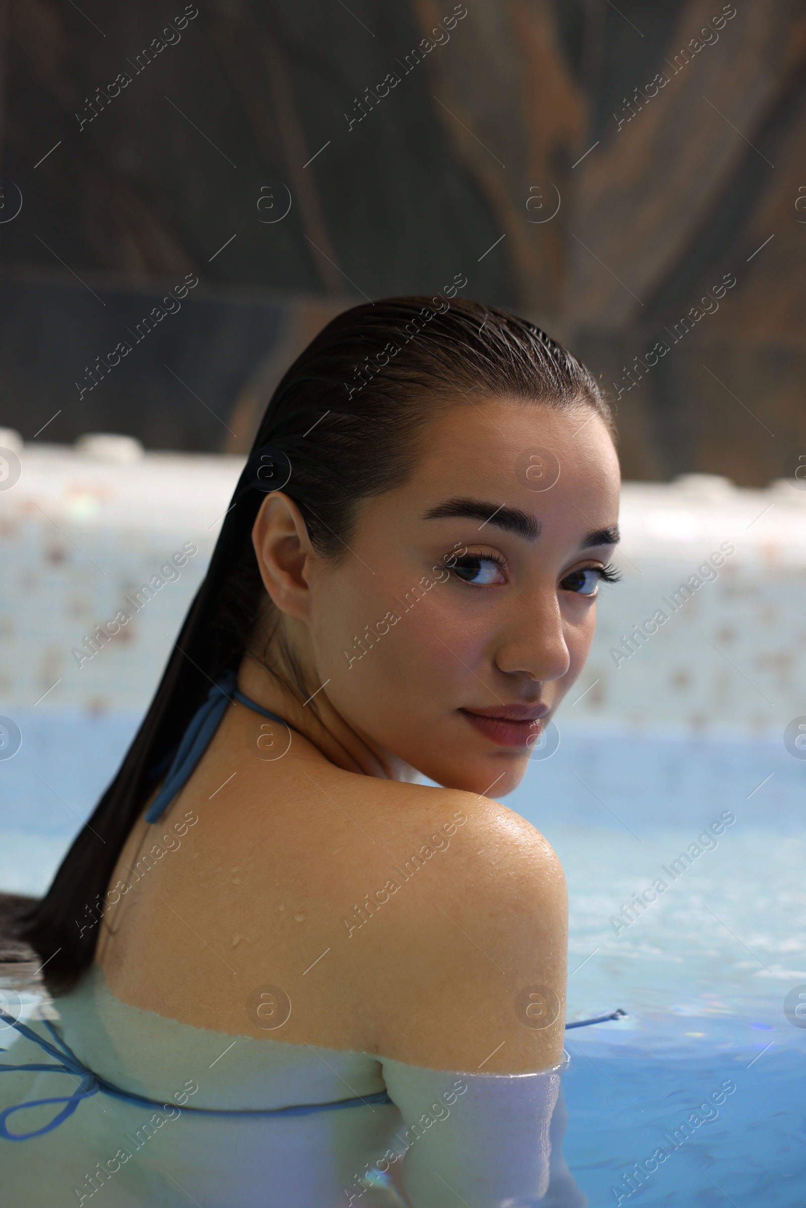 Photo of Beautiful woman relaxing in spa swimming pool