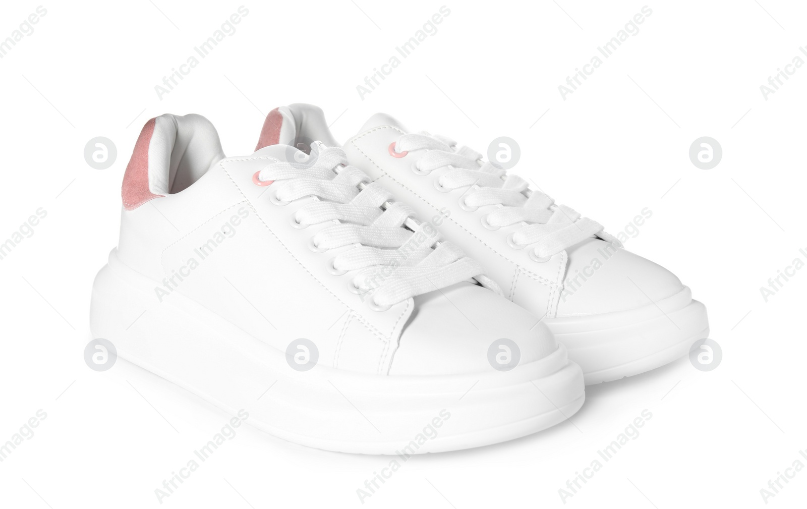 Photo of Pair of stylish sneakers on white background