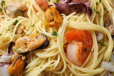 Delicious pasta with sea food as background, top view
