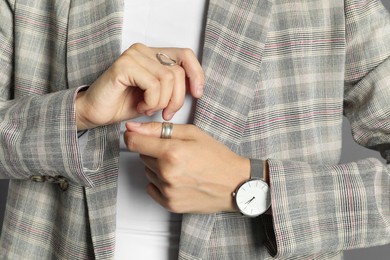 Photo of Beautiful woman with stylish jacket and accessories, closeup