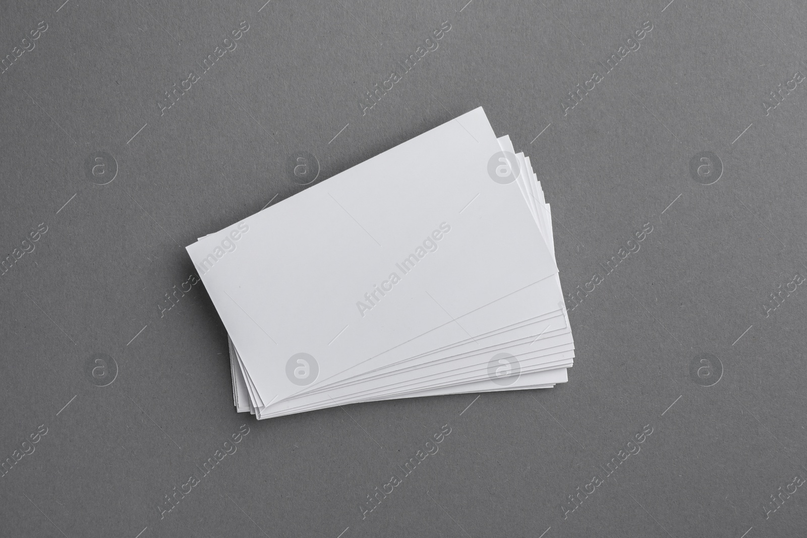 Photo of Blank business cards on grey background, top view. Mockup for design