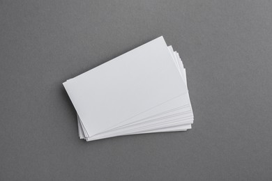 Photo of Blank business cards on grey background, top view. Mockup for design