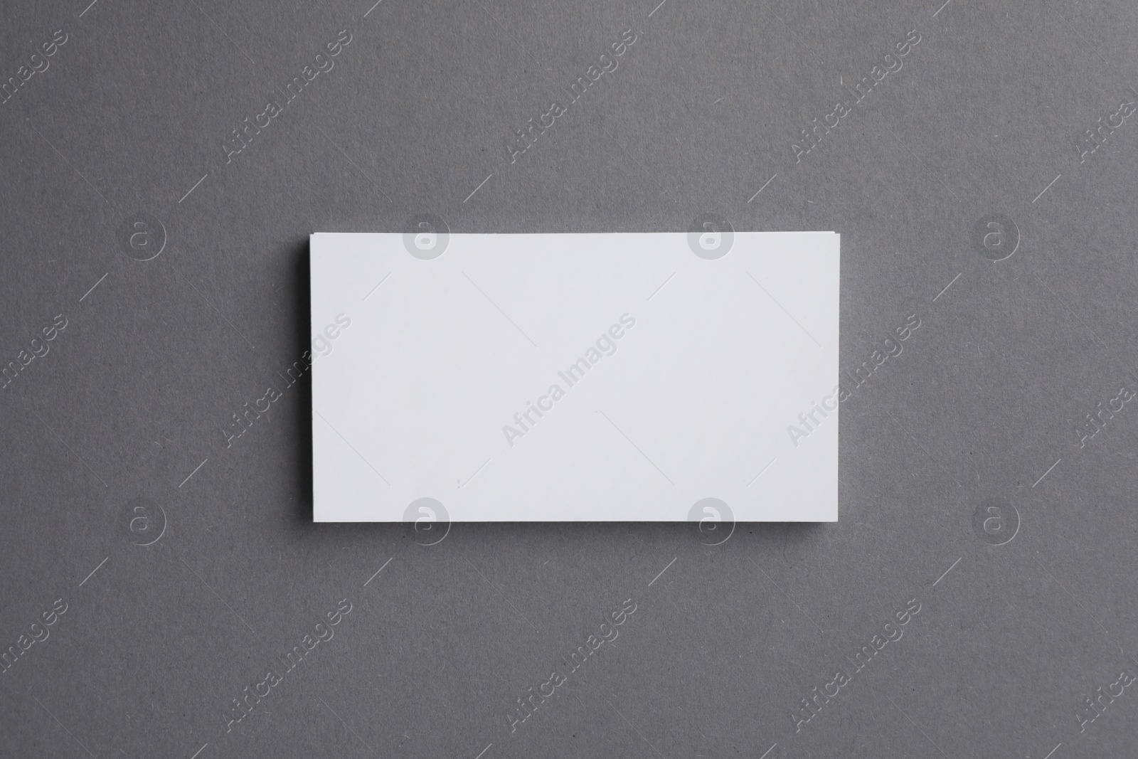 Photo of Blank business cards on grey background, top view. Mockup for design