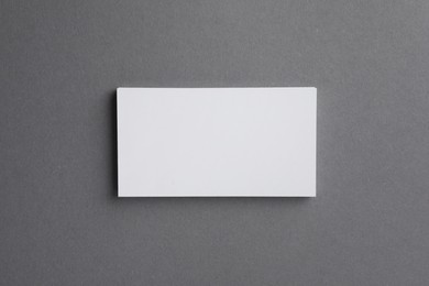 Photo of Blank business cards on grey background, top view. Mockup for design