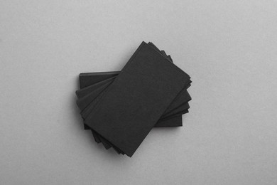 Photo of Blank business cards on grey background, top view. Mockup for design