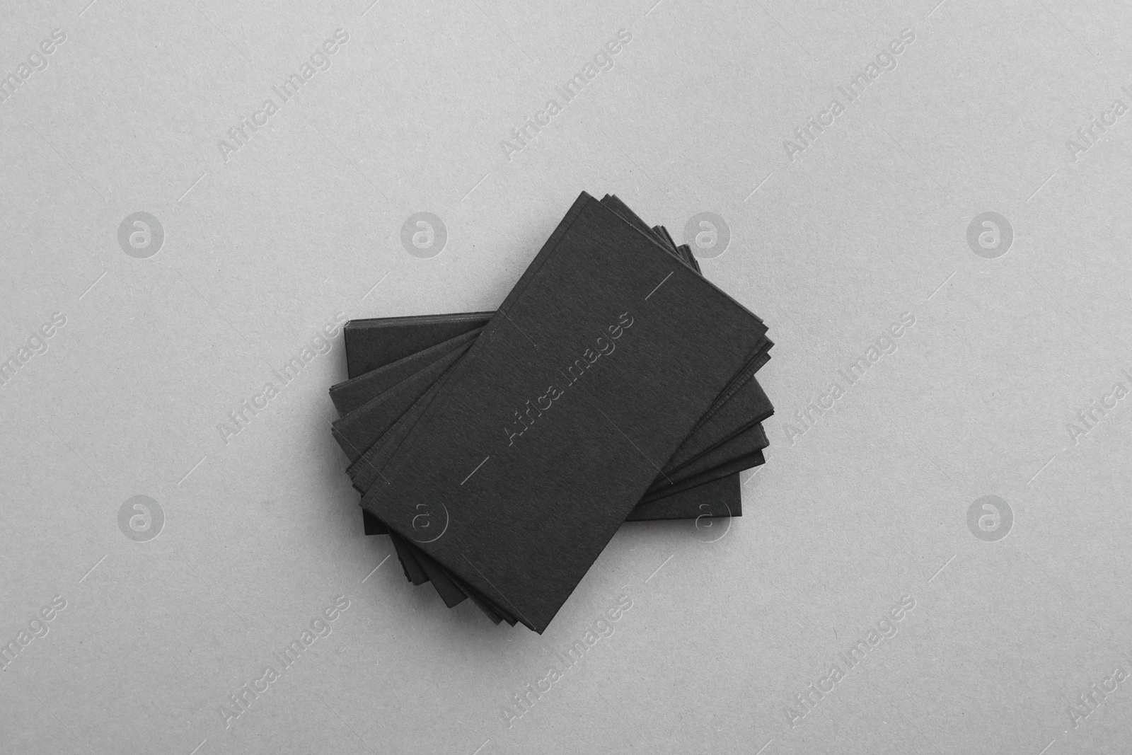 Photo of Blank business cards on grey background, top view. Mockup for design