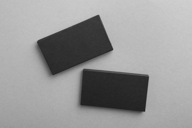 Blank business cards on grey background, top view. Mockup for design