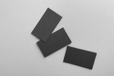 Photo of Blank business cards on grey background, top view. Mockup for design