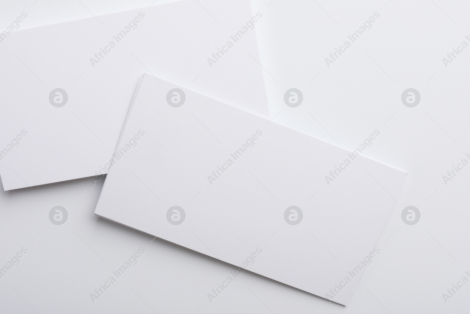 Photo of Blank business cards on light grey background, top view. Mockup for design