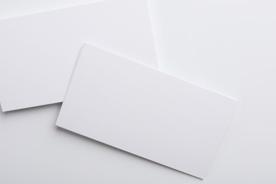 Photo of Blank business cards on light grey background, top view. Mockup for design