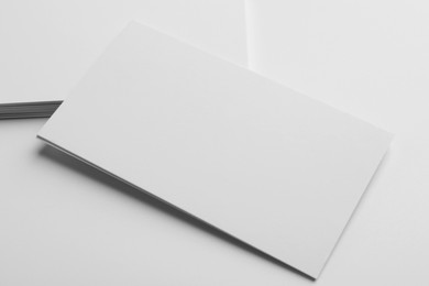 Blank business cards on light grey background. Mockup for design