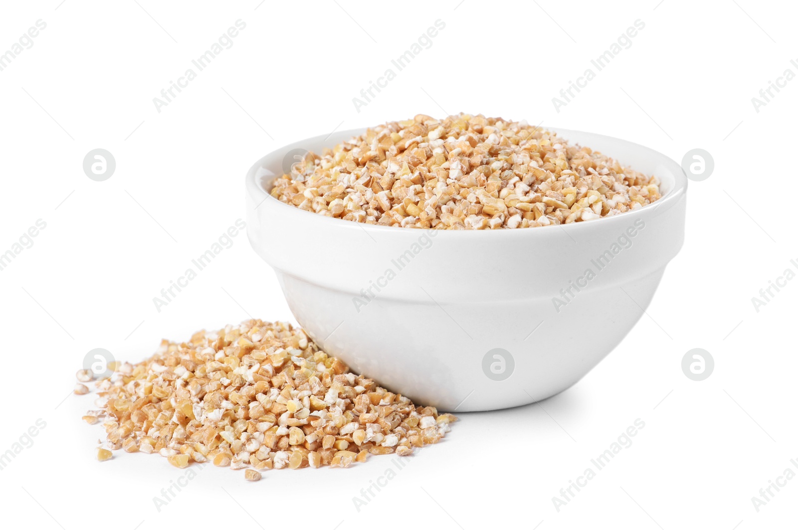 Photo of Dry wheat groats in bowl isolated on white