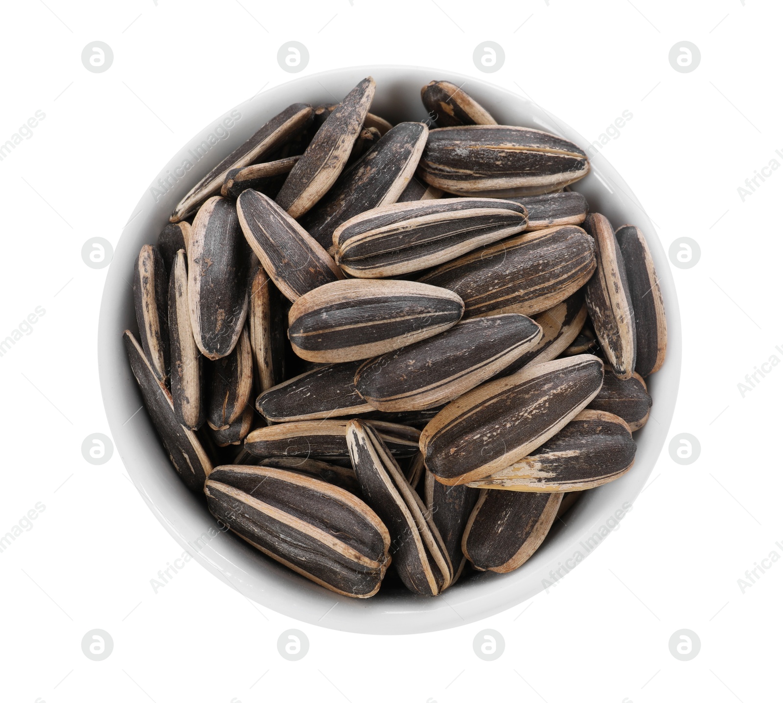 Photo of Sunflower seeds in bowl isolated on white, top view