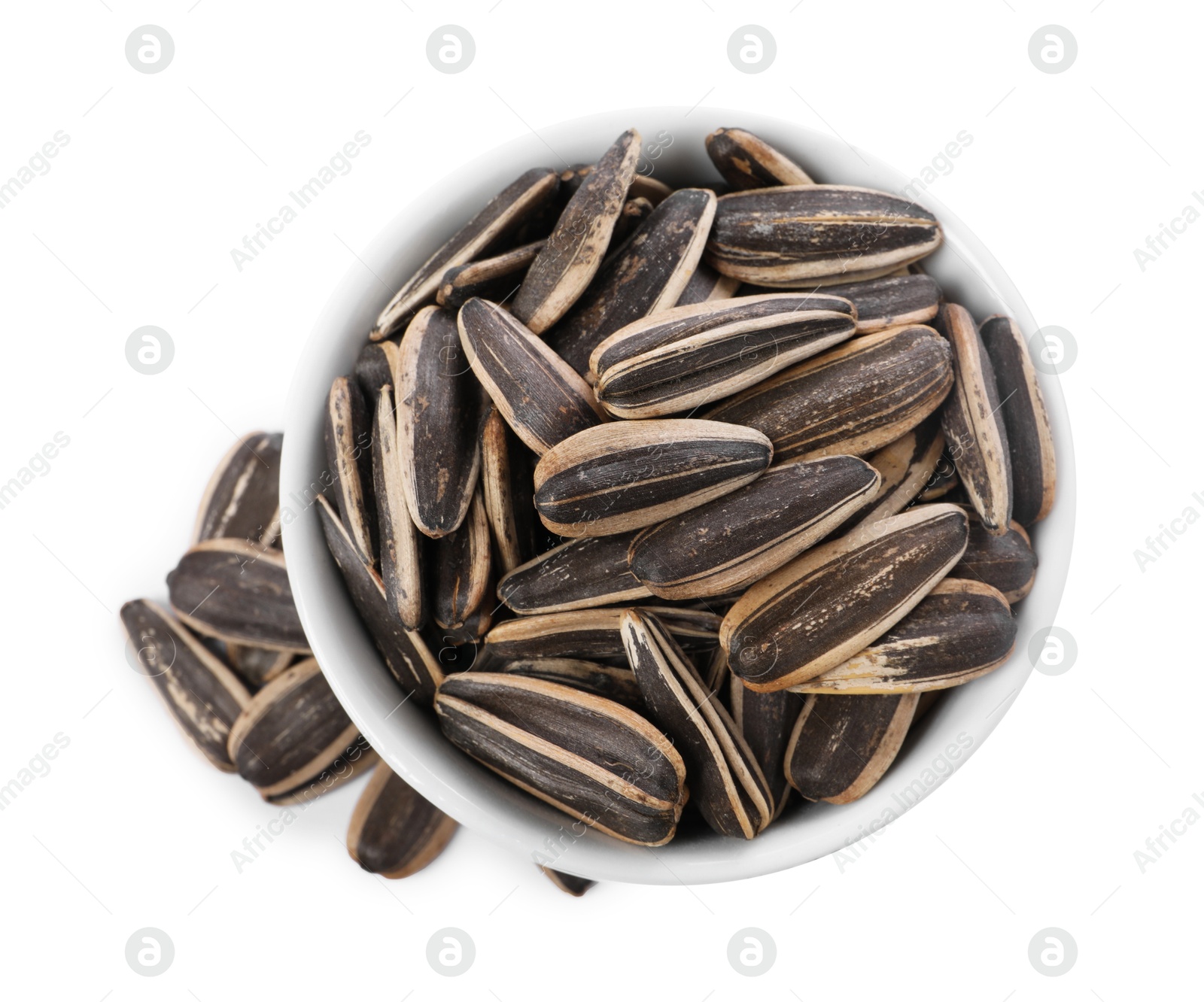 Photo of Sunflower seeds in bowl isolated on white, top view