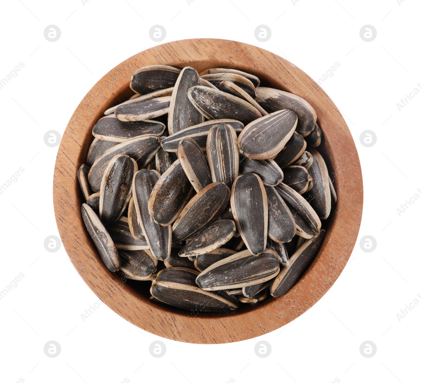 Photo of Sunflower seeds in wooden bowl isolated on white, top view