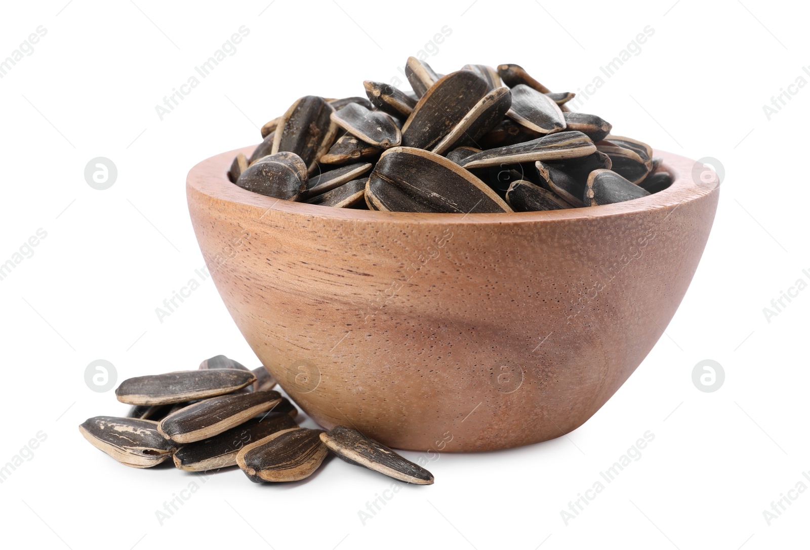 Photo of Sunflower seeds in wooden bowl isolated on white