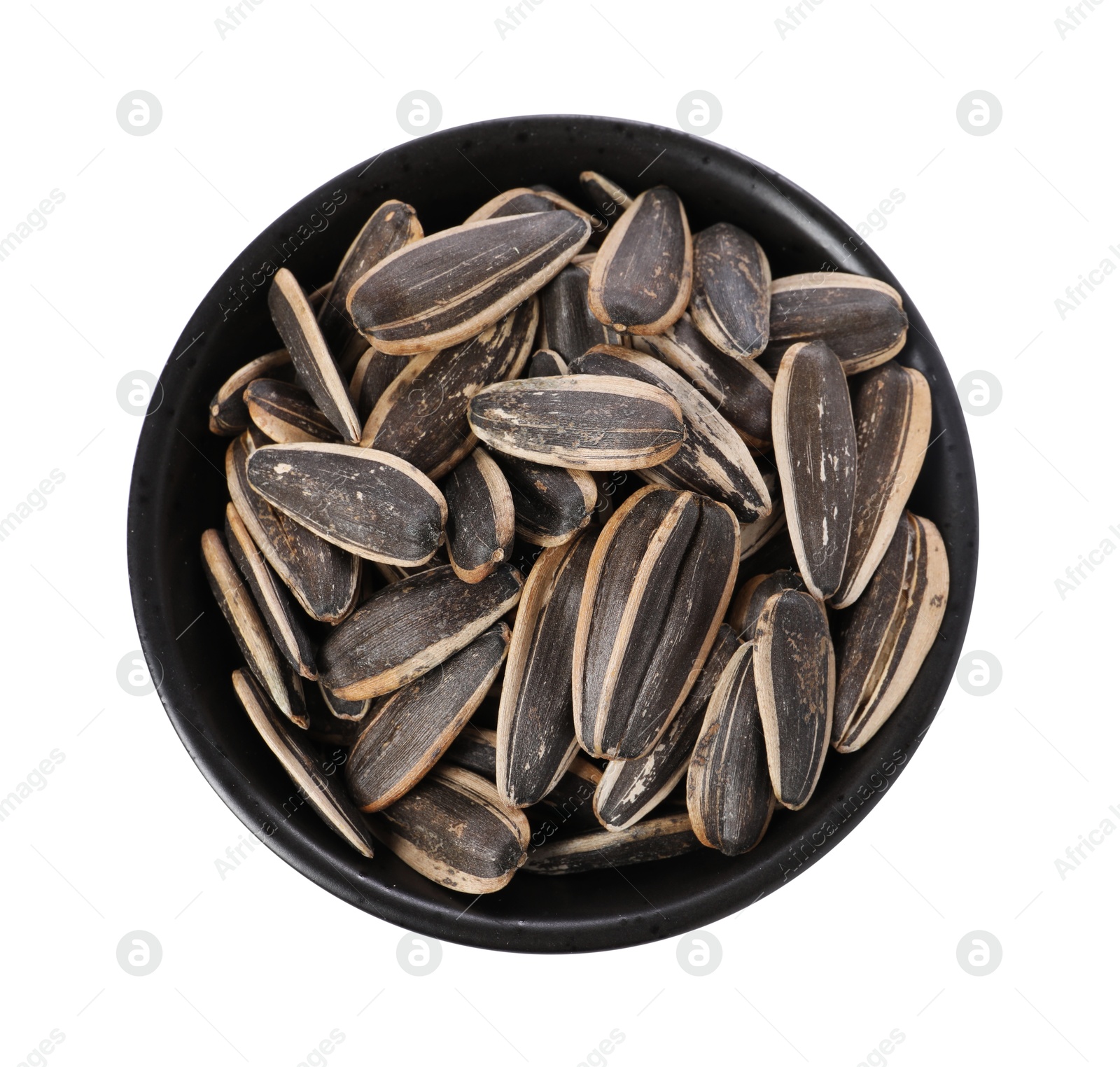 Photo of Sunflower seeds in bowl isolated on white, top view