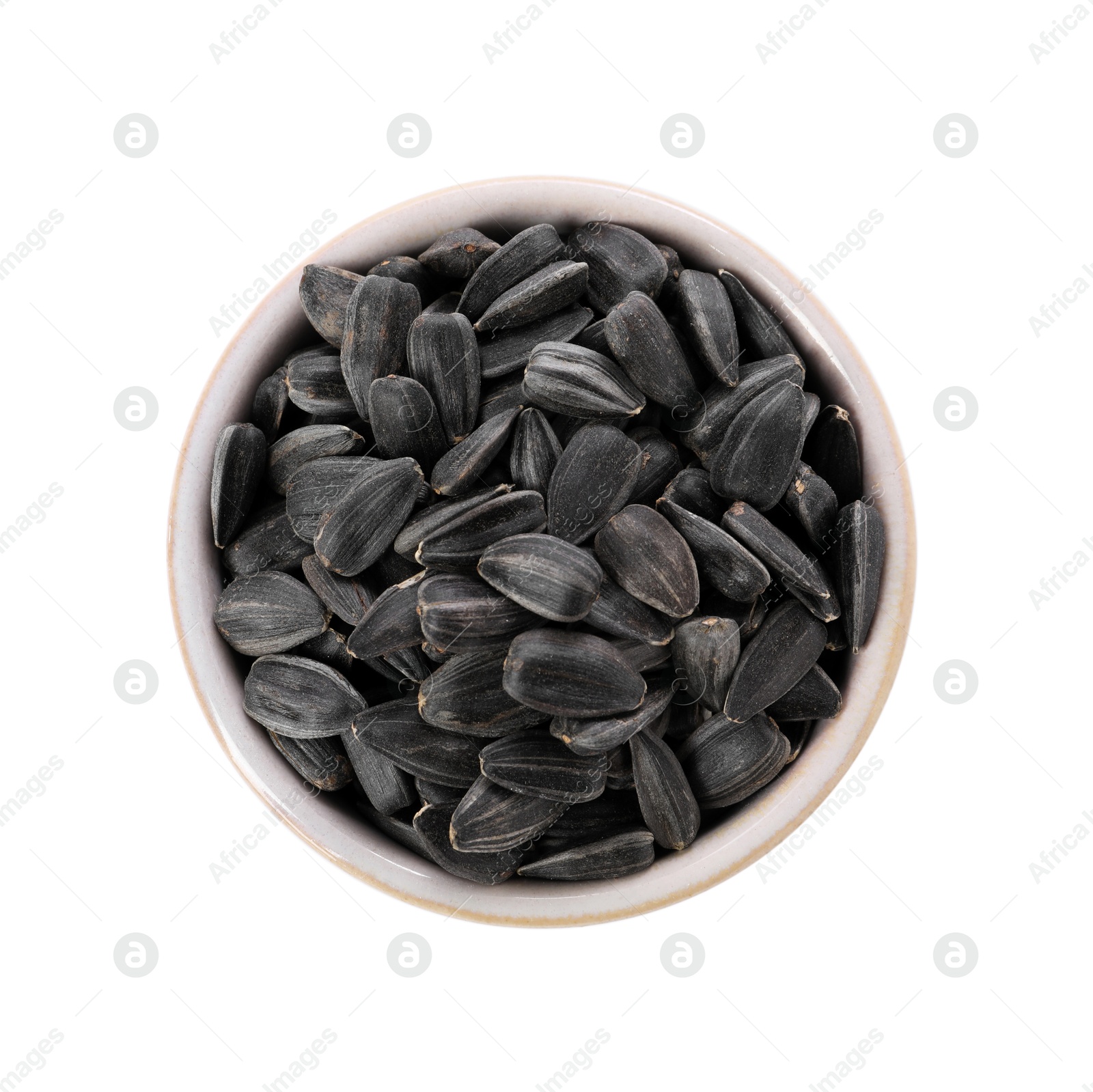 Photo of Sunflower seeds in bowl isolated on white, top view