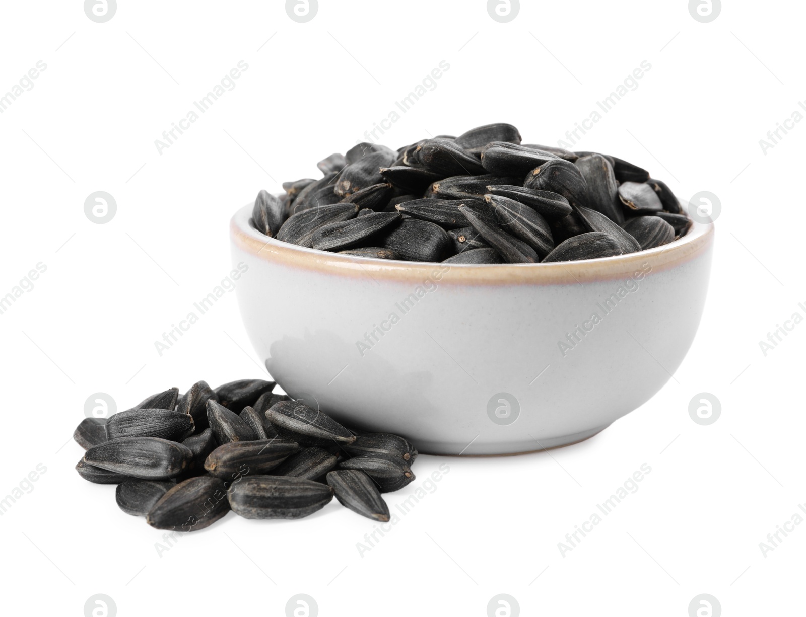 Photo of Sunflower seeds in bowl isolated on white