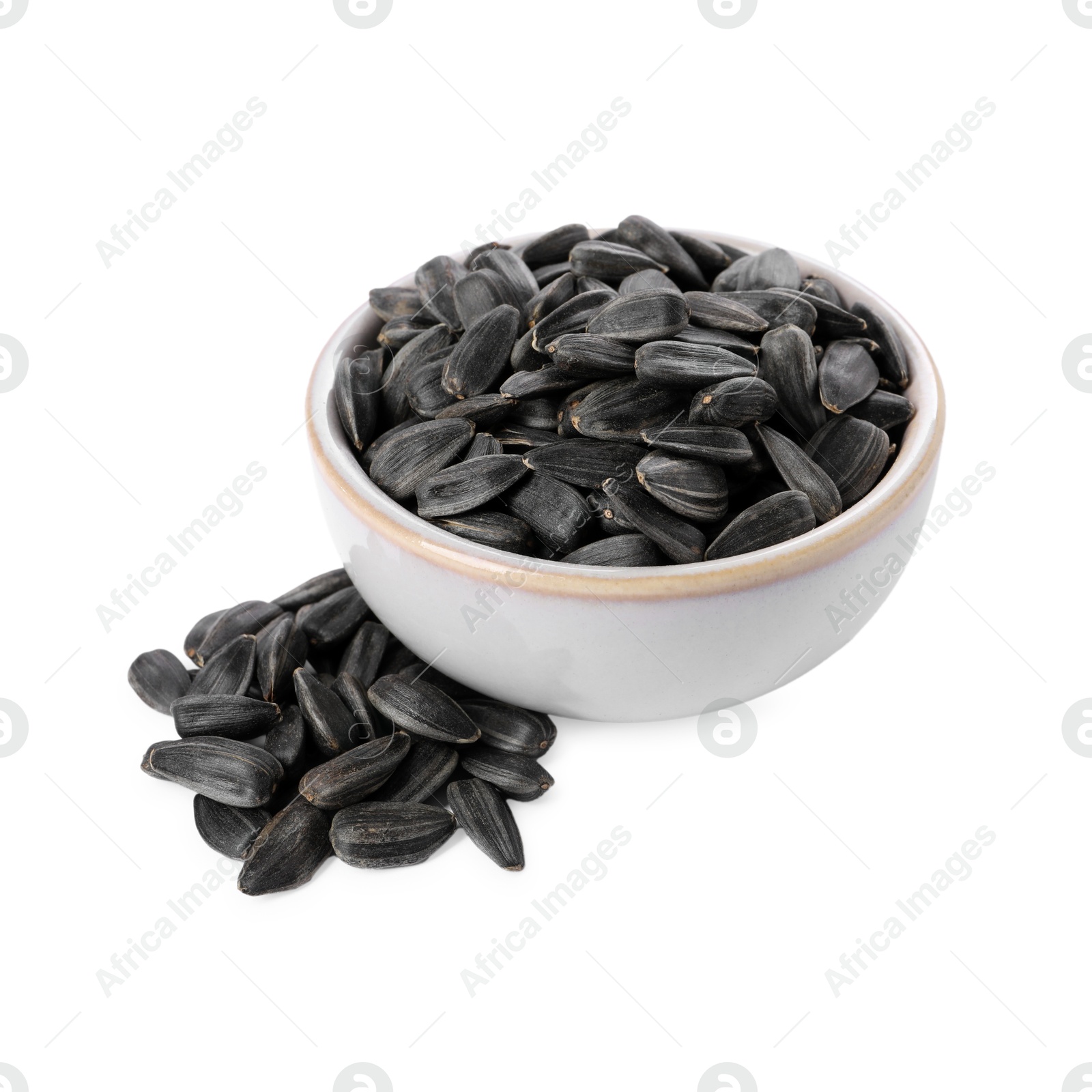 Photo of Sunflower seeds in bowl isolated on white