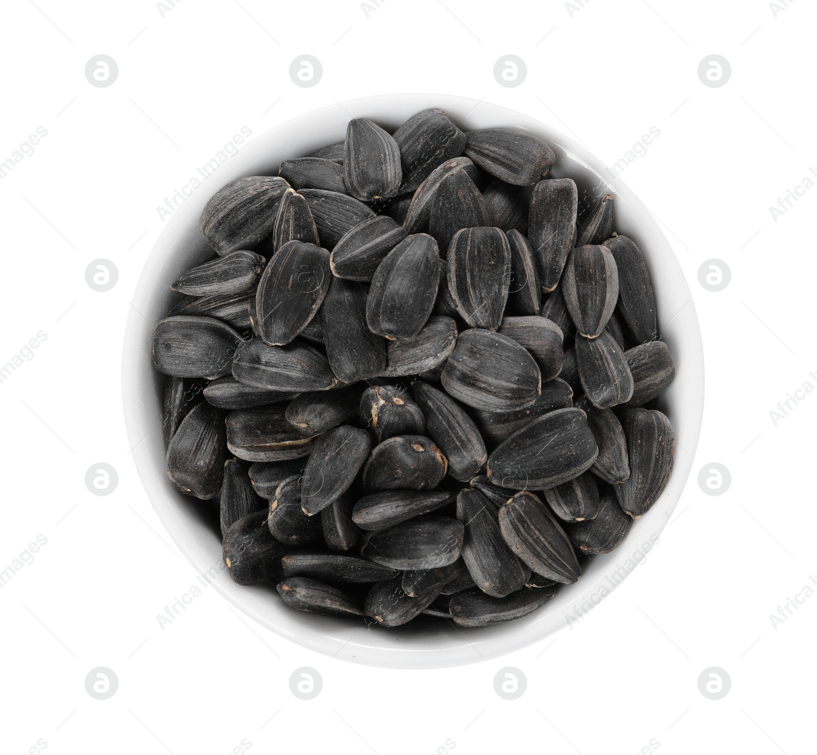 Photo of Sunflower seeds in bowl isolated on white, top view