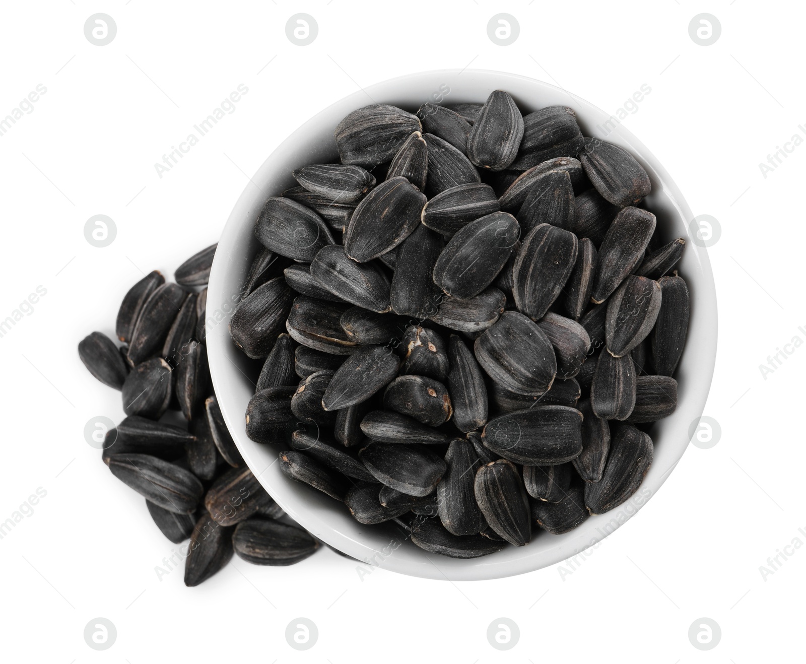 Photo of Sunflower seeds in bowl isolated on white, top view