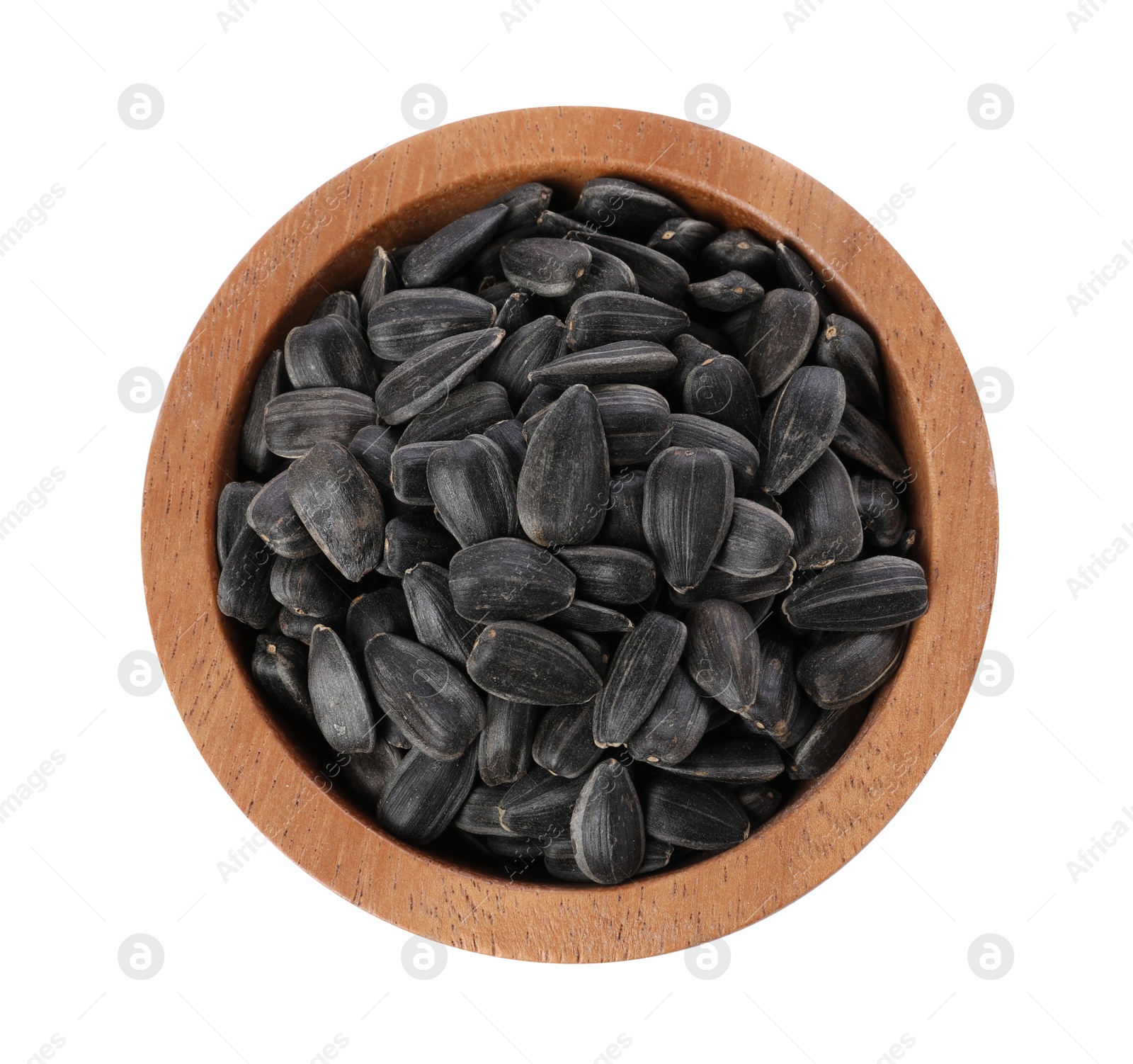 Photo of Sunflower seeds in wooden bowl isolated on white, top view