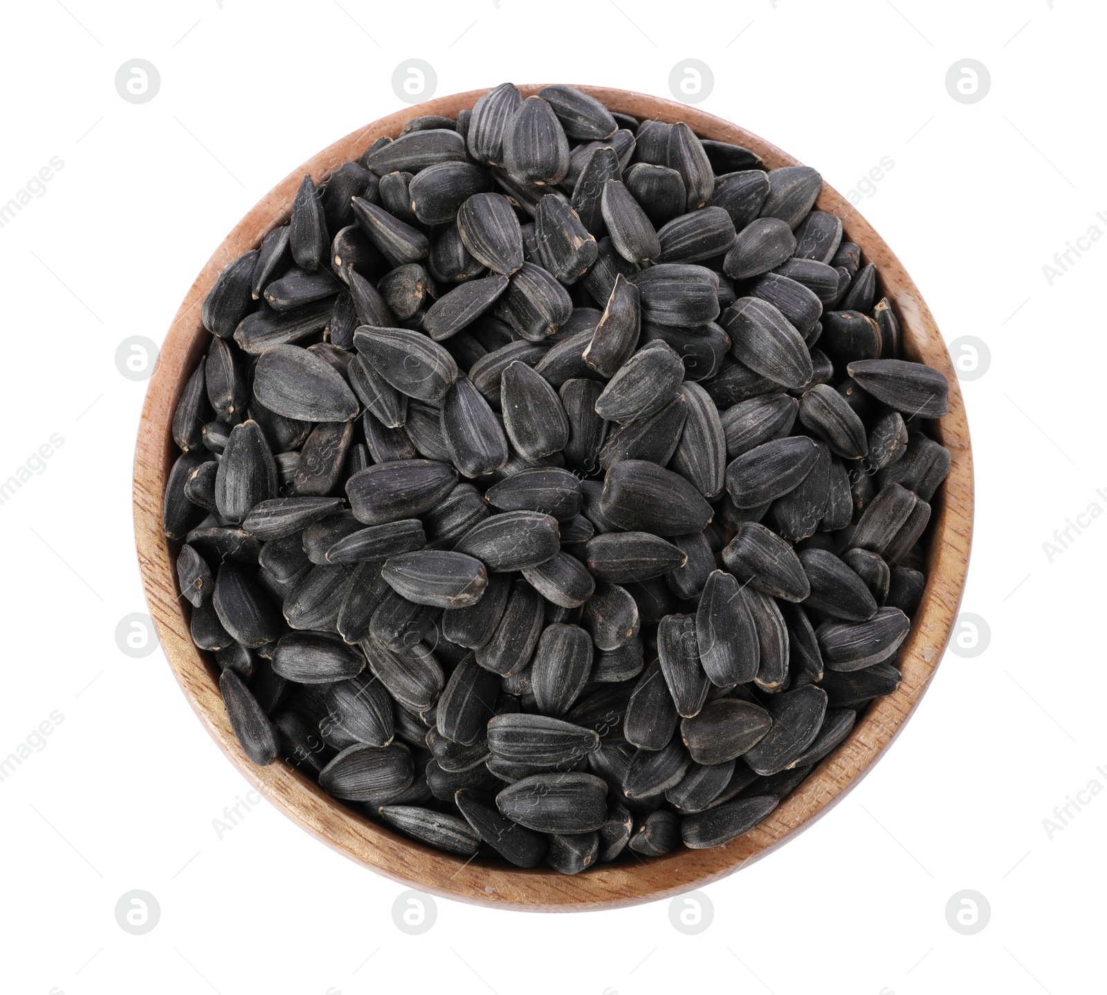 Photo of Sunflower seeds in wooden bowl isolated on white, top view