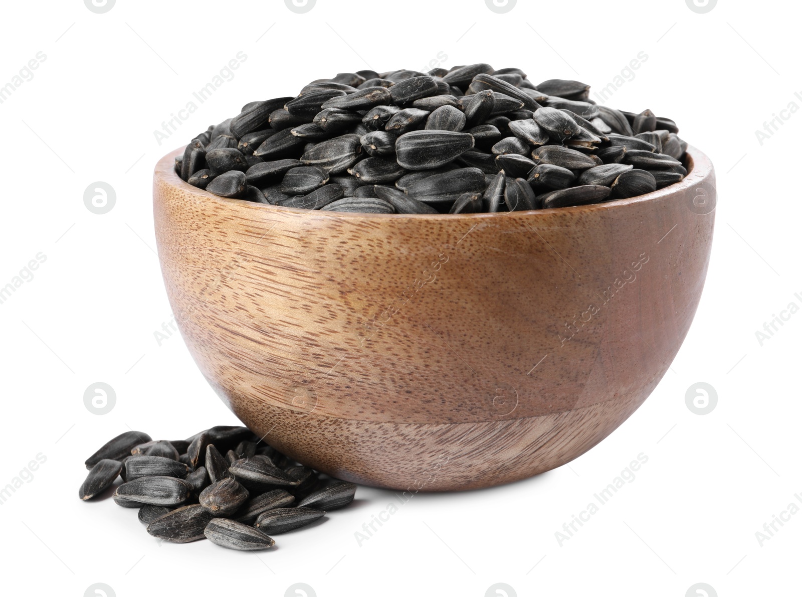 Photo of Sunflower seeds in wooden bowl isolated on white