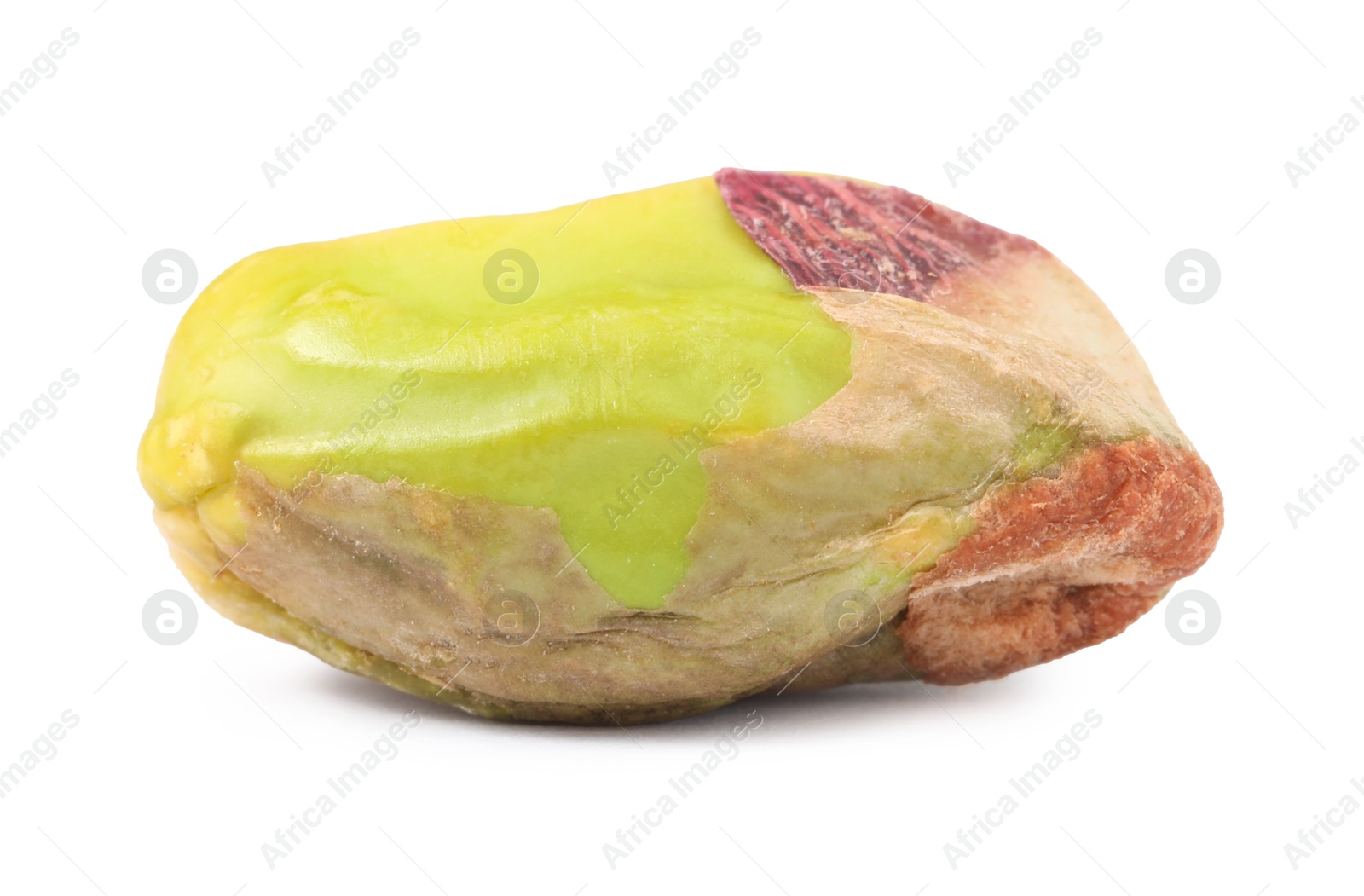 Photo of One peeled pistachio nut isolated on white