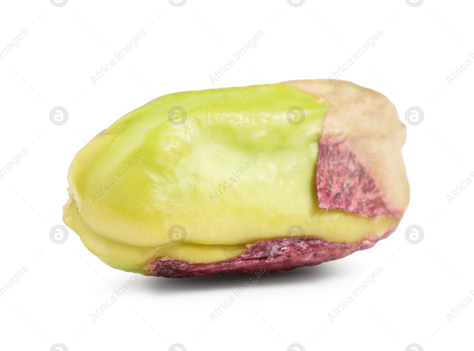 Photo of One peeled pistachio nut isolated on white