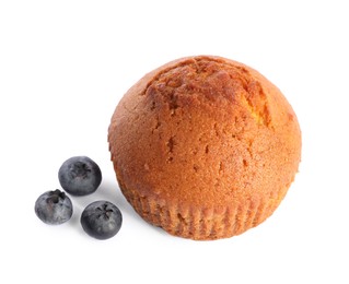 Photo of Delicious sweet muffin and blueberries isolated on white