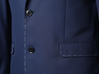 Blue semi-ready jacket with pocket, closeup view