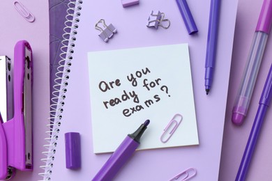 Paper note with question Are You Ready For Exams and stationery on purple background, flat lay