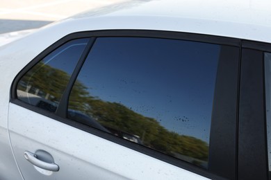 Photo of Modern auto with dirty stains, closeup view