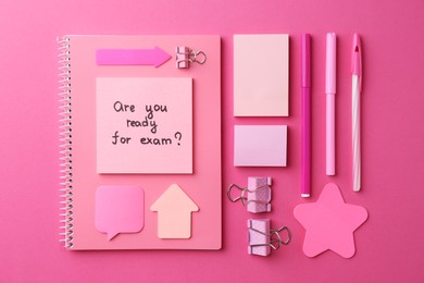 Paper note with question Are You Ready For Exam and stationery on pink background, flat lay