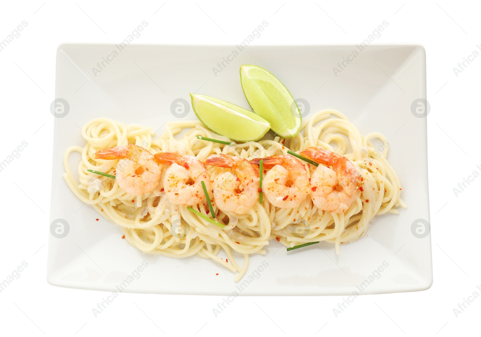 Photo of Delicious pasta with shrimps, green onions and lime isolated on white, top view