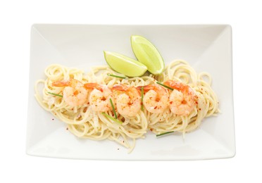 Photo of Delicious pasta with shrimps, green onions and lime isolated on white, top view