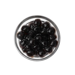 Photo of Dark tapioca pearls in bowl isolated on white, top view