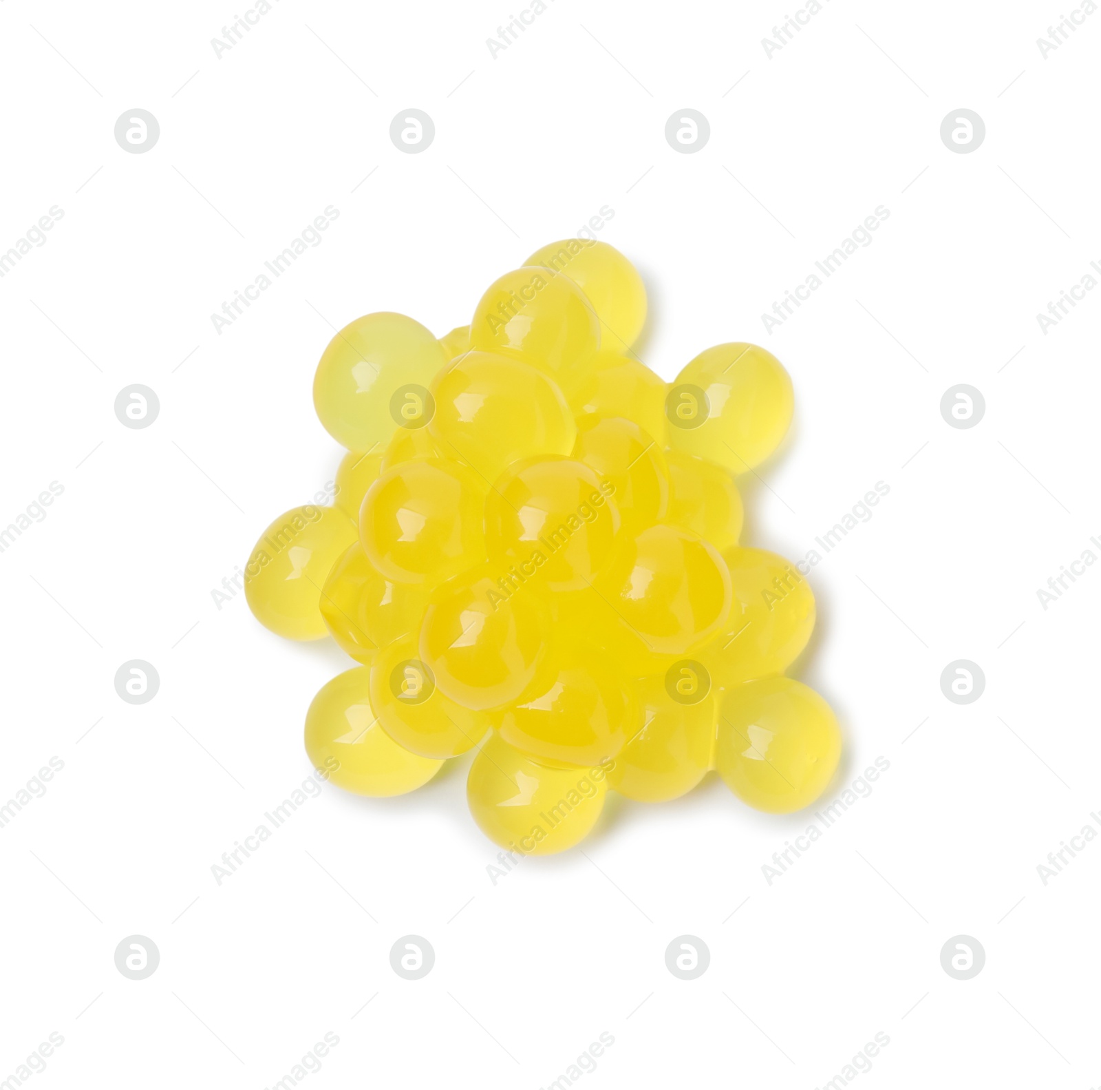 Photo of Pile of bright tapioca pearls isolated on white, top view