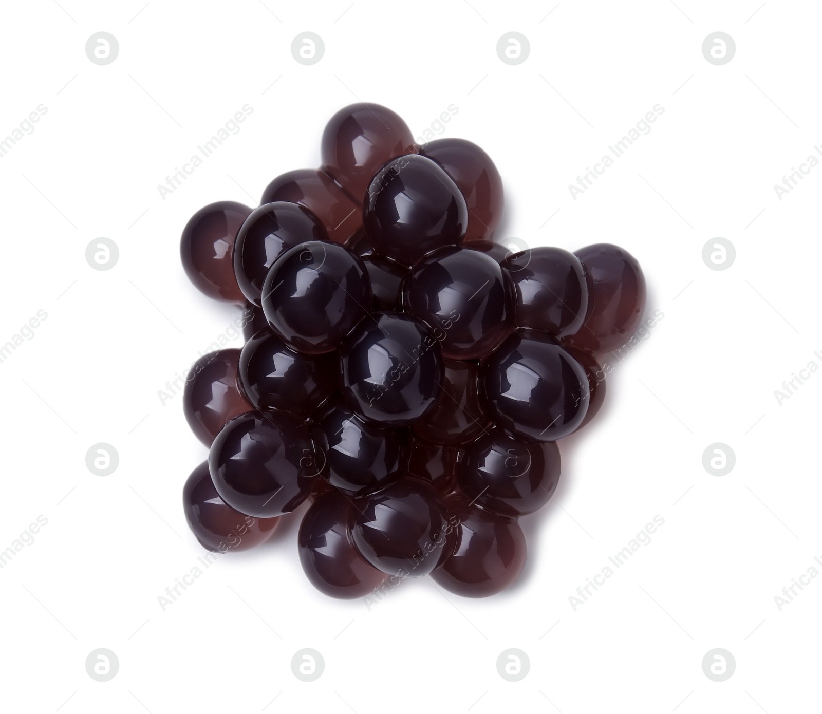 Photo of Pile of dark tapioca pearls isolated on white, top view