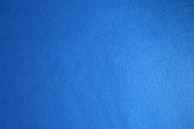 Photo of Blue textured surface as background, top view