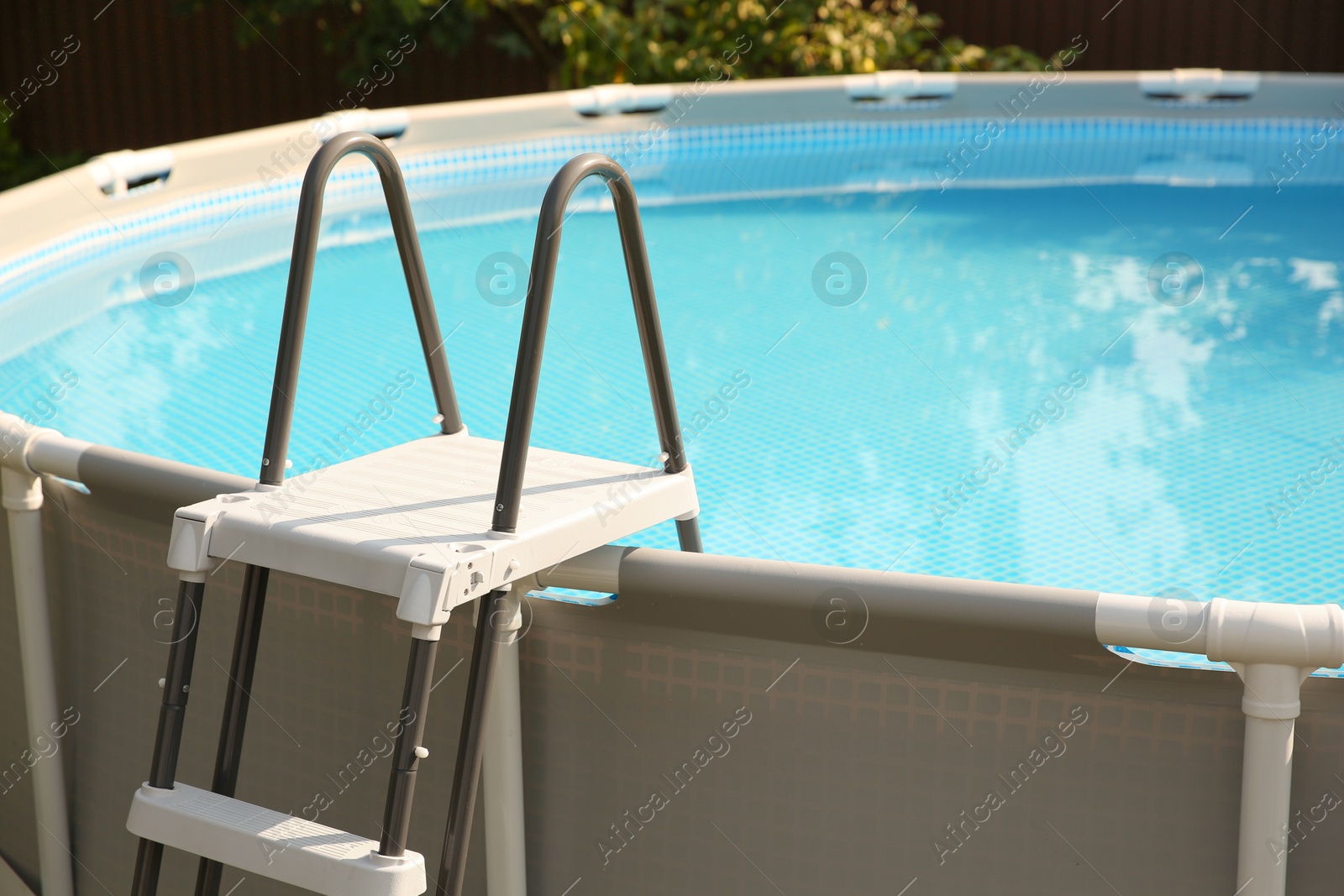 Photo of Above ground swimming pool outdoors on sunny day