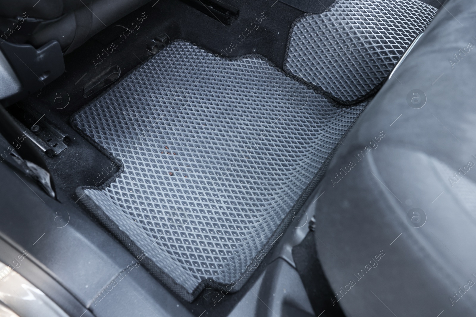 Photo of Grey rubber car floor mat in auto