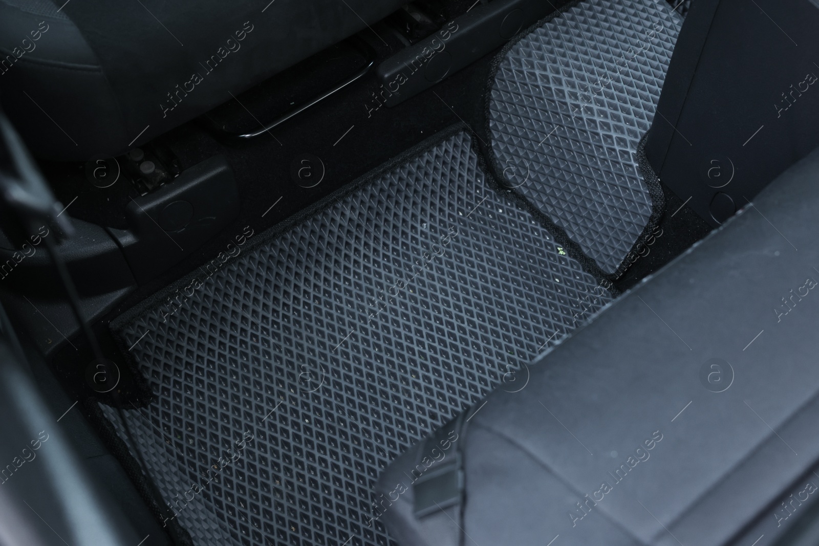 Photo of Grey rubber car floor mat in auto