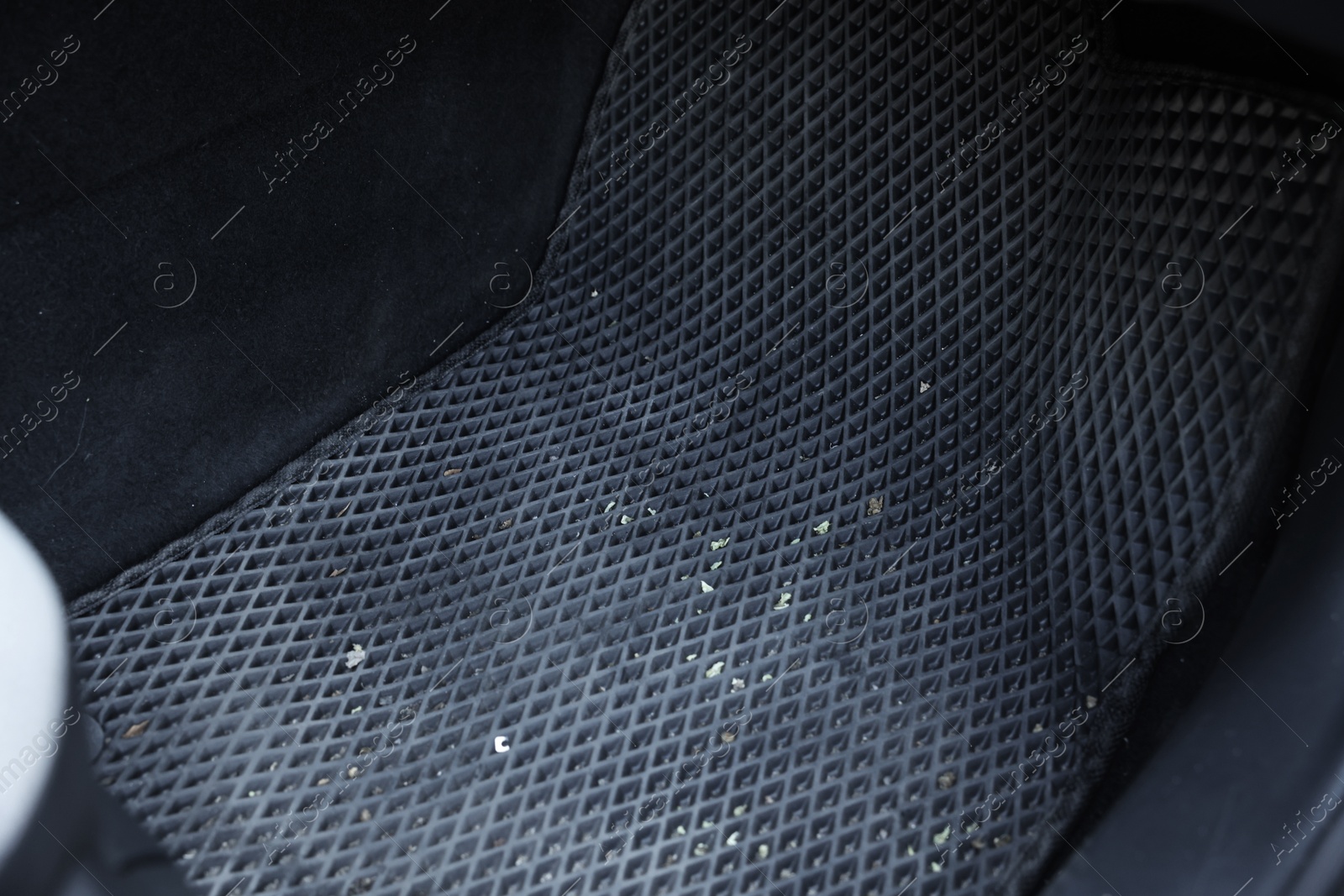 Photo of Grey rubber car floor mat in auto