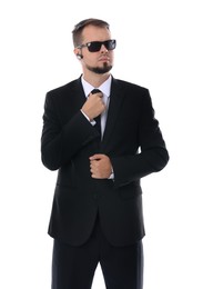 Young bodyguard in suit and sunglasses isolated on white