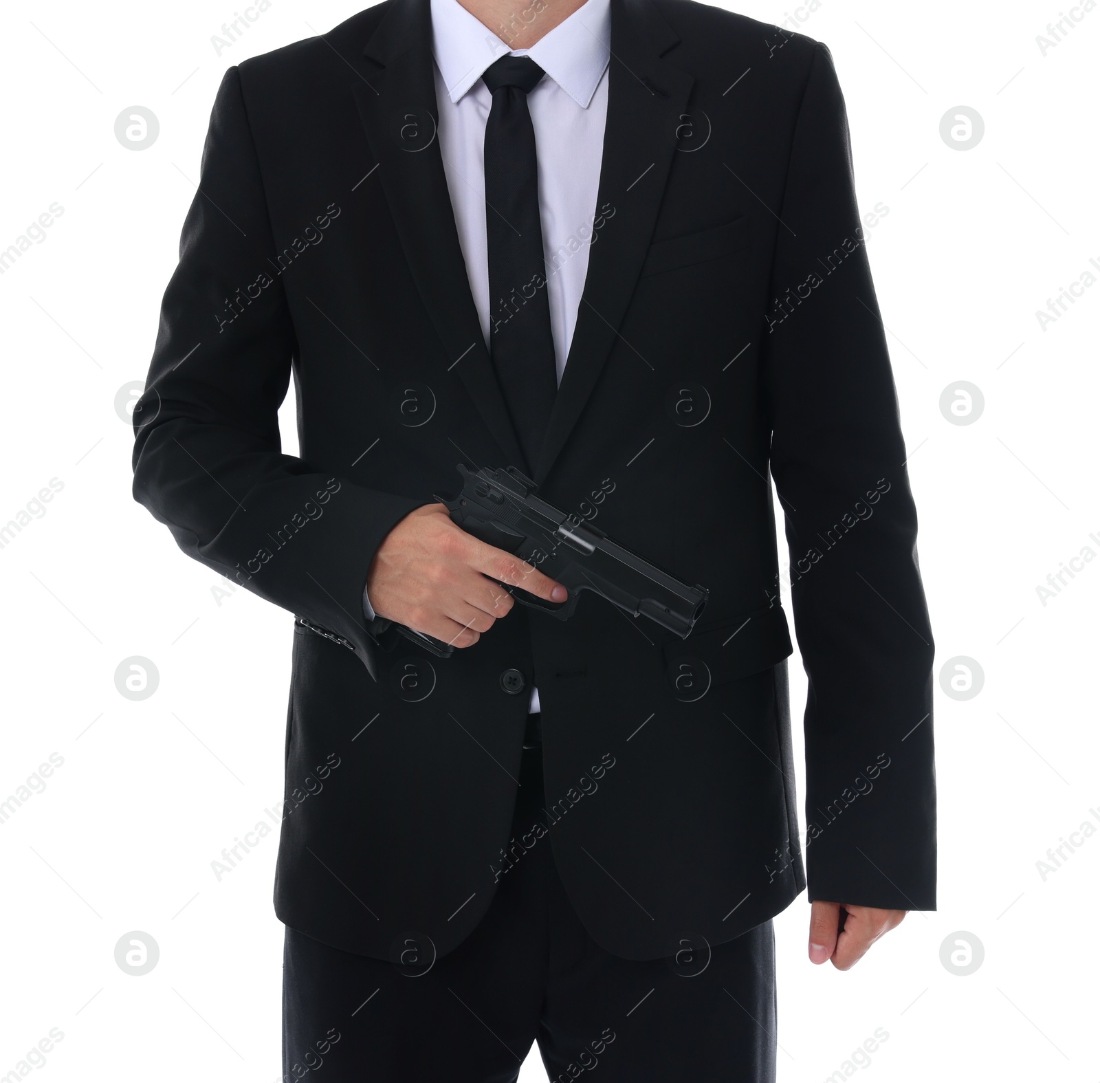 Photo of Young bodyguard in suit with gun isolated on white, closeup