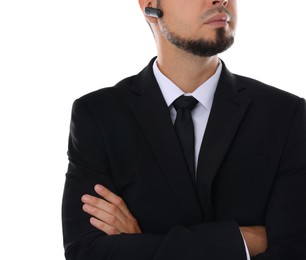 Photo of Young bodyguard in suit with earpiece isolated on white, closeup